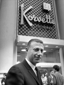 Eugene Ferkauf, owner of E. J. Korvette department store, standing outside by storefront on Fifth Avenue 